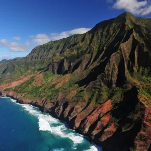 a body of water with Nā Pali Coast State Park in the background