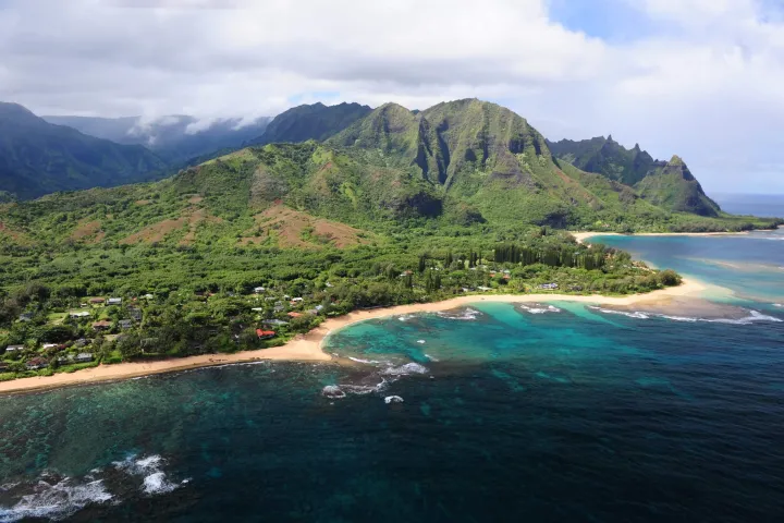 a body of water with a mountain in the background