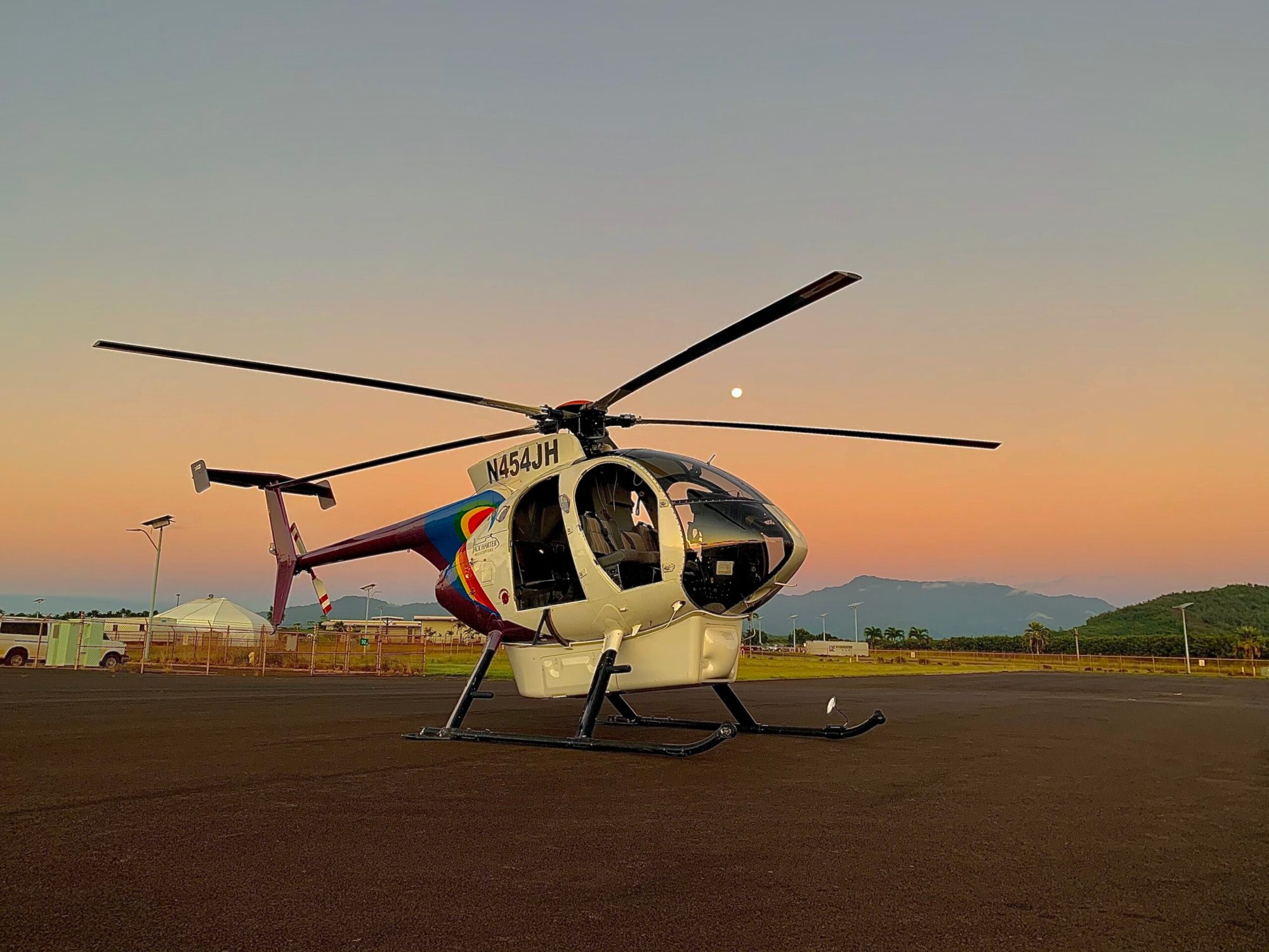 a plane sitting on top of a helicopter