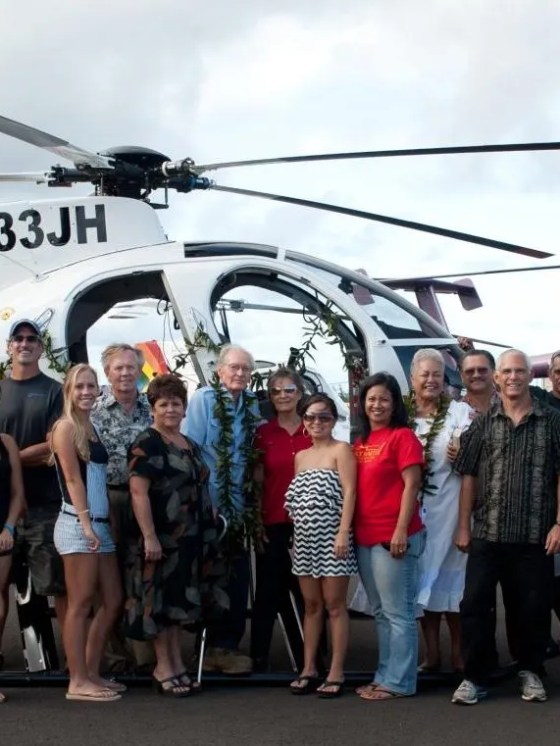 JHH employees standing in front of helicopters